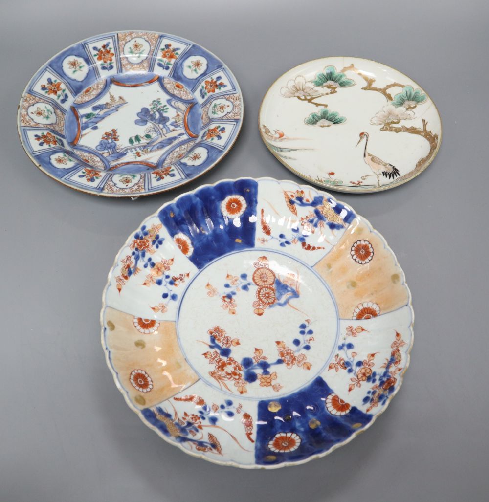 A 17th century Arita crane dish and an 18th century Chinese Imari fluted dish and similar soup plate, largest diameter 26cm